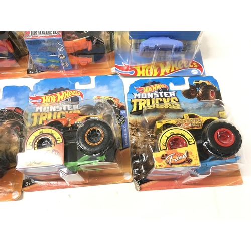 348 - A collection of 12 Hot Wheels Monster Trucks 1:64 scale. Includes All Fried Up..Zombie Wrex..plus ot... 