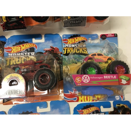 348 - A collection of 12 Hot Wheels Monster Trucks 1:64 scale. Includes All Fried Up..Zombie Wrex..plus ot... 