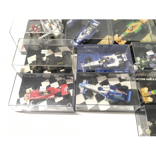 35 - A collection of 19 model F1 racing call all in display boxes.