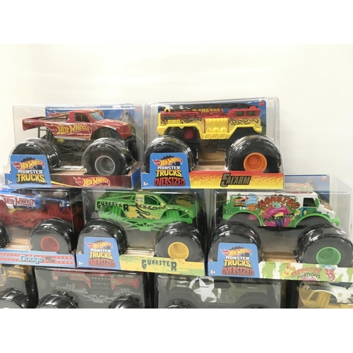 350 - A collection of 9 Hot Wheels Monster Trucks 1:24 scale..includes Gunkster..Too School..plus others n... 