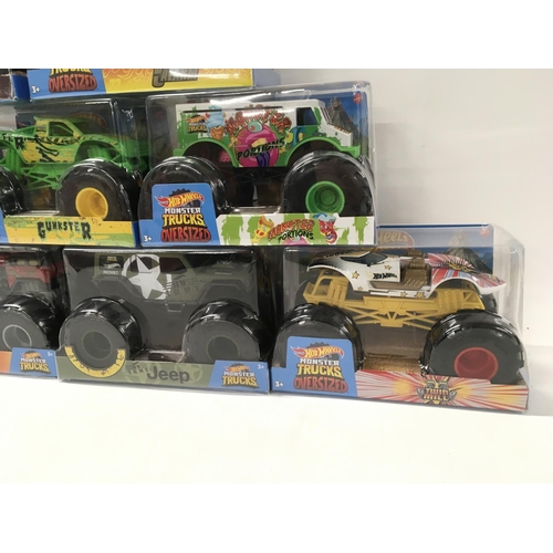 350 - A collection of 9 Hot Wheels Monster Trucks 1:24 scale..includes Gunkster..Too School..plus others n... 