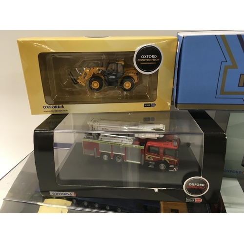 352 - A collection of of 9 boxed diecast commercial and construction vehicles. 1:76 scale. No reserve