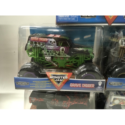 358 - A collection of 5 unopened Monster Jam monster trucks 1:24 scale. Includes Batman..Grave Digger and ... 