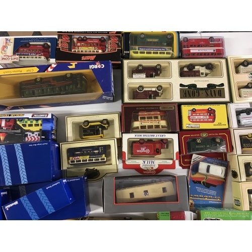 37 - A collection in excess of 50 model vehicles including buses.cars and commercial mostly boxed in the ... 