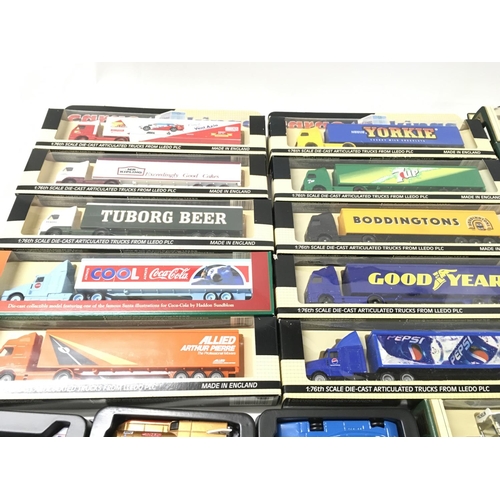 384 - A collection of 25 boxed model vehicles including truck and trailers..vans and cars. Manufacturers i... 