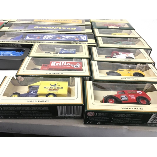 384 - A collection of 25 boxed model vehicles including truck and trailers..vans and cars. Manufacturers i... 