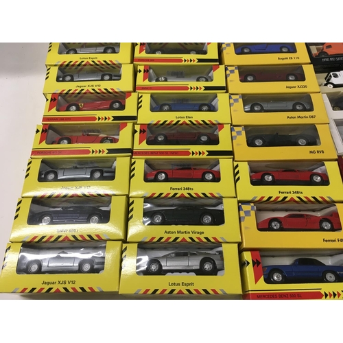 385 - A collection in excess of 40 boxed model vehicles includes Shell sports cars..days gone..vanguards. ... 