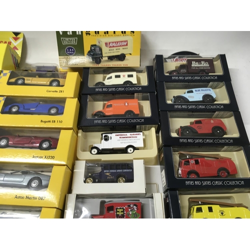 385 - A collection in excess of 40 boxed model vehicles includes Shell sports cars..days gone..vanguards. ... 