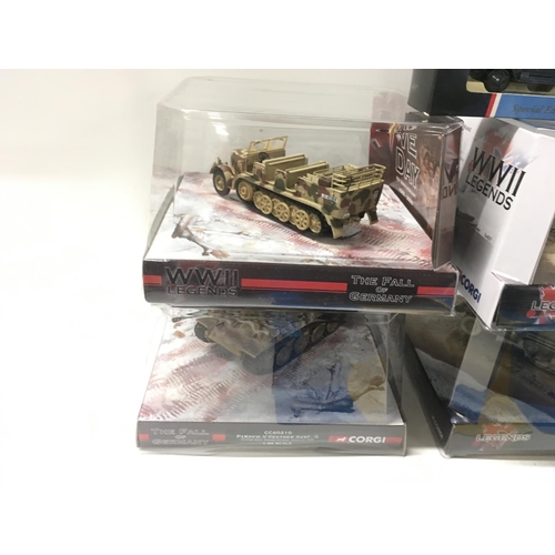 392 - A collection of 9 boxed WW11 themed diecast models by Corgi and Lledo. Includes planes..Tank. Etc.