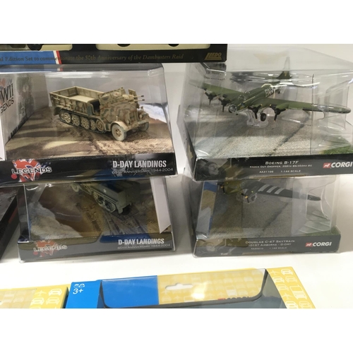 392 - A collection of 9 boxed WW11 themed diecast models by Corgi and Lledo. Includes planes..Tank. Etc.