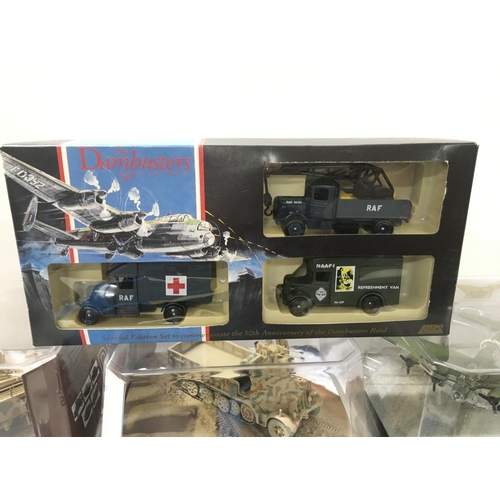 392 - A collection of 9 boxed WW11 themed diecast models by Corgi and Lledo. Includes planes..Tank. Etc.