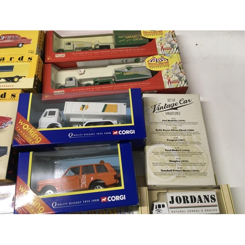 393 - A collection in excess of 25 boxed diecast vehicles manufactured by Corgi..Lledo..Maisto etc. includ... 