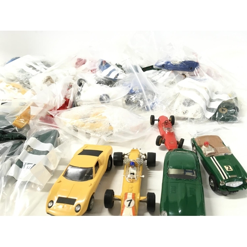 399 - A collection of Scalextric cars..parts and accessories. No reserve