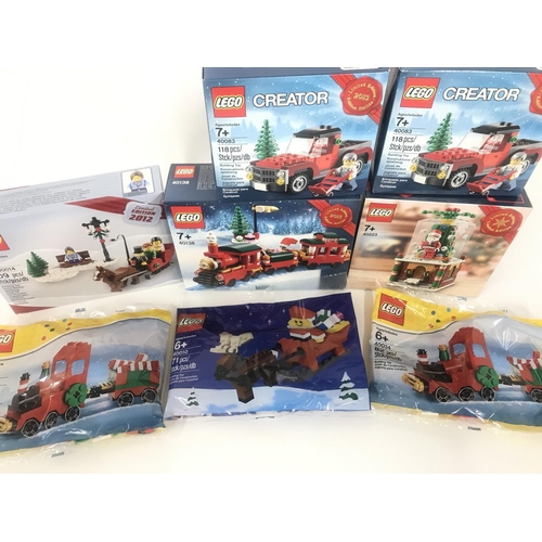 431 - A Collection of Boxed And Sealed Lego Christmas Sets. 2 X Christmas Tree Truck. #40083. A Snow Globe... 