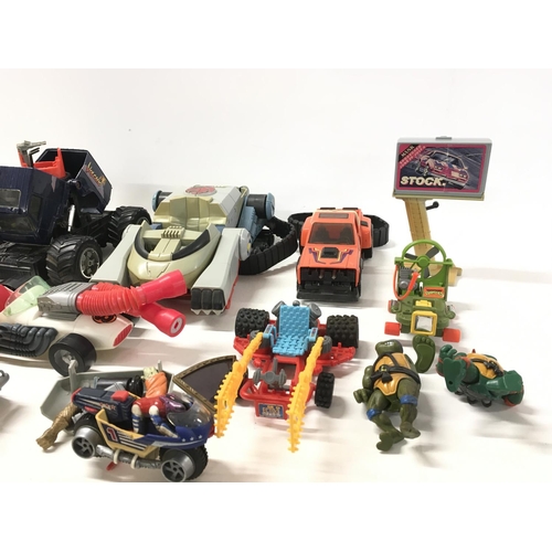 45 - A collection of vintage vehicles ..accessories and figures from Ghostbusters..Mask..Thundercats and ... 