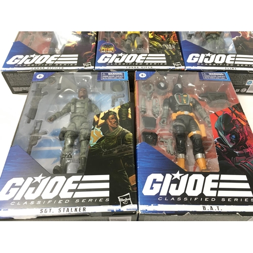 48 - A collection of 8 boxed GI Joe classified action figures.