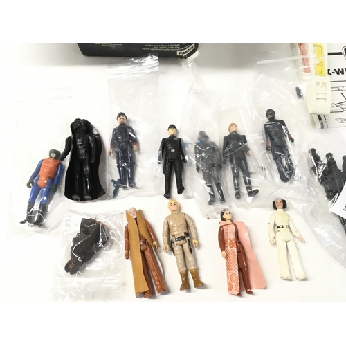 49 - A collection of vintage Star Wars figures and vehicles including a scout Walker with box.