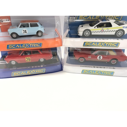 505 - 6 X Boxed Scalextric Cars. A Chevrolet Monte Carlo. A Austin Mini. A Ford Cortina GT. A Lotus Esprit... 