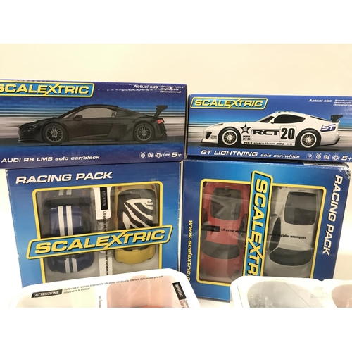 514 - 2 X Scalextric Racing Packs. A Boxed Audi R8 LMS. A GT Lightning and other Cars.