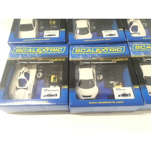 525 - A collection of 6 boxed Scalextric pro performance car assembly kit all unstarted.