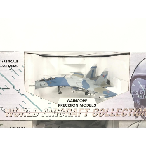 55 - 2 X Boxed Gaincorp Precision Model Aircraft. A Sukhoi SU-27 and a F-22 Raptor both 1/72 Scale. (2). ... 