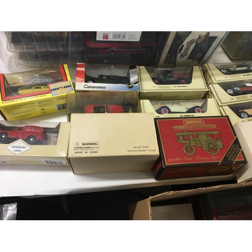 587 - Large collection of boxed model diecast models including a large number of model fire engines etc. N... 