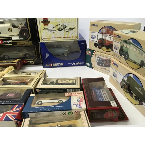 595 - A collection of boxed diecast model cars by Corgi..Burago etc. also includes approximately 15 unboxe... 