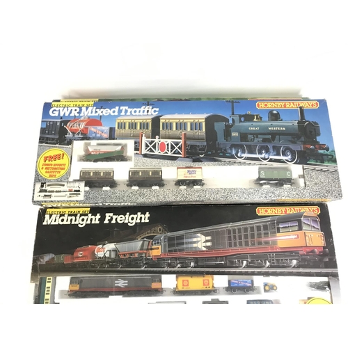 677 - 3 boxed Hornby Railways sets. Sets include Midnight Freight. Eight Freight and GWR Mixed Traffic. Al... 