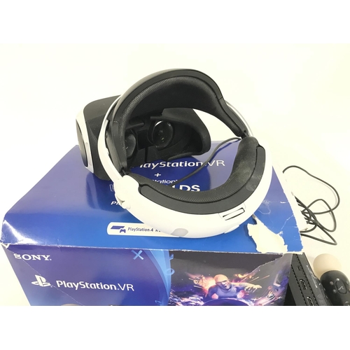 679 - A used and boxed Sony PlayStation Worlds VR headset. Complete with headset. Powerpack. Camera. All r... 