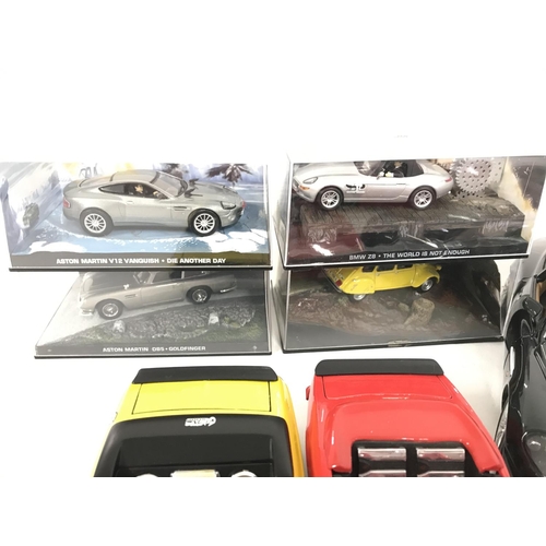 680 - A box containing a collection of model cars. To include some James Bond models. Maisto scale cars an... 