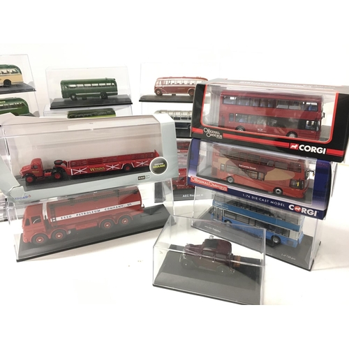 690 - A collection of 19 diecast model vehicles in display boxes featuring buses..fire engines..tanker etc... 