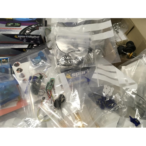 704 - A large collection of spare parts and accessories for Scalextric cars. No reserve