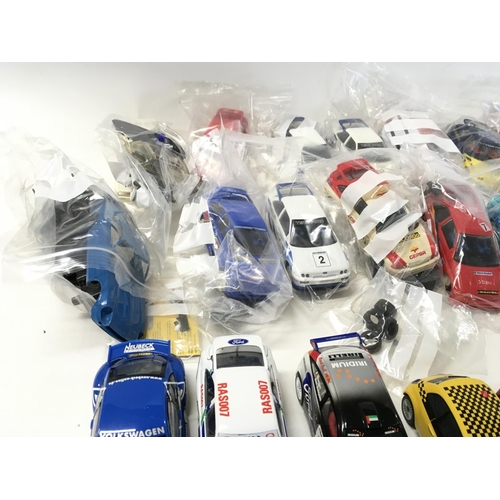 708 - A collection of Scalextric cars spares and accessories. No reserve