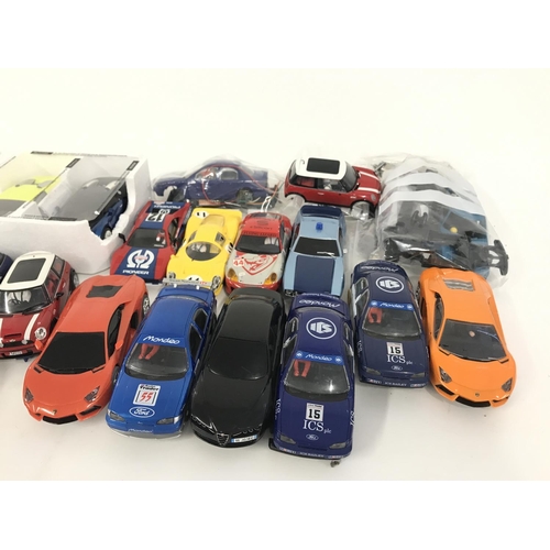 713 - A box containing a collection of used Scalextric cars and accessories. No reserve.