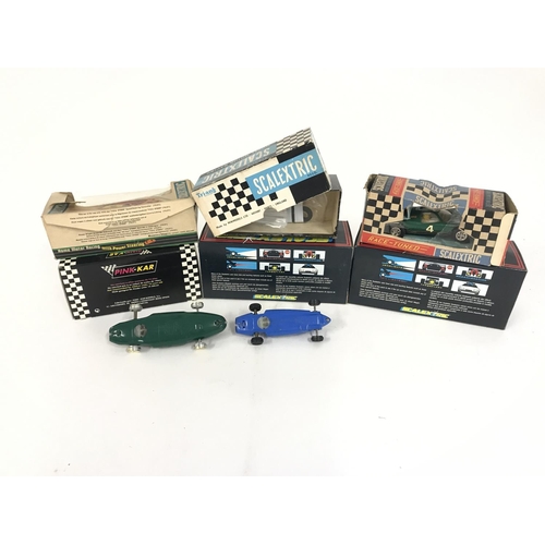 715 - A collection of 7 Scalextric cars. Including some vintage examples. No reserve.