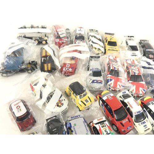 719 - A collection of approximately 30 Scalextric cars. Plus some accessories and spares. No reserve.