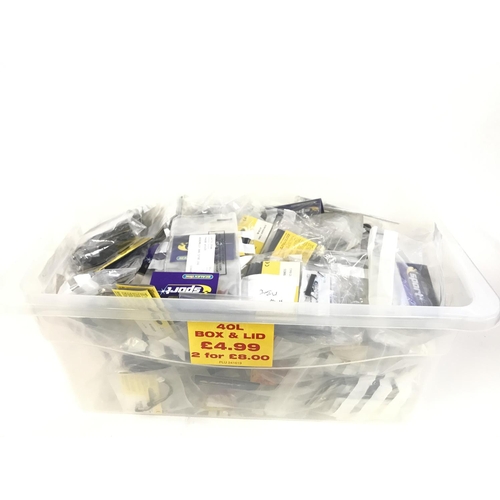 725 - A box containing a large quantity of spare Scalextric parts. Mostly bagged and new. No reserve.