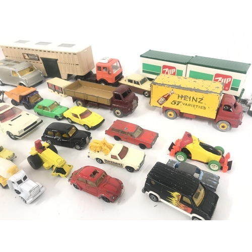 752 - A Box Containing Playworn Plastic and Diecast Vehicles including Matchbox. Dinky. And Others. No Res... 