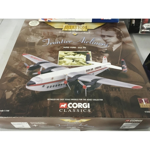 81 - A collection of four model aircraft in original display packaging by Corgi..MotorMax and Maisto. Inc... 