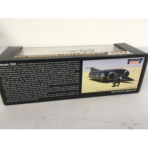 83 - A boxed model of Thrust the worlds first supersonic car. This model has been signed by Andy Green th... 