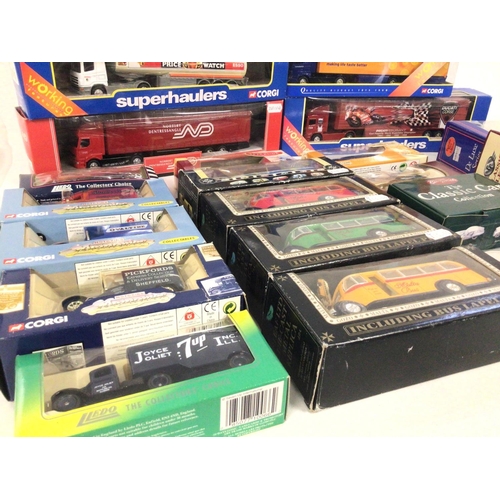 830 - A collection in excess of 20 boxed model vehicles including cars ..buses and commercials. Manufactur... 