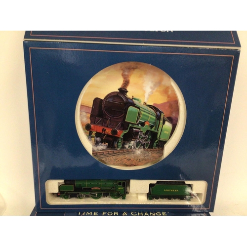 836 - A pair of Royal Doulton commemorative plates made for Hornby railway. Each also contains a model tra... 