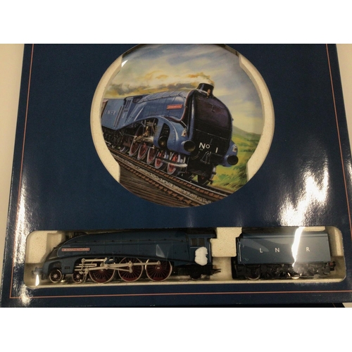 836 - A pair of Royal Doulton commemorative plates made for Hornby railway. Each also contains a model tra... 