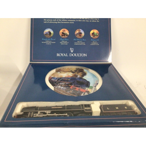 837 - A pair of Royal Doulton commemorative plates made for Hornby Railways each containing a model train.... 