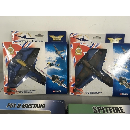 84 - A collection of 5 military model aircraft in the original display packaging by Corgi and Witty Wings... 