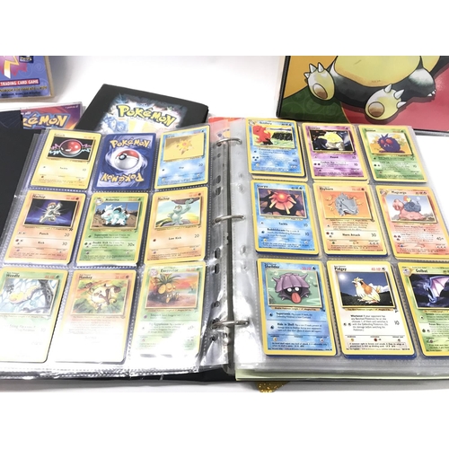 98 - 4 X Binders Containing Vintage Pokemon and Digimon Cards. A incomplete Merlin Sticker Book and Coin ... 