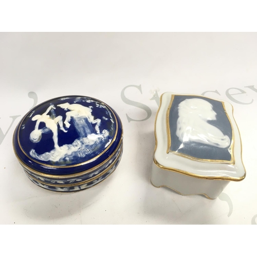1003 - Two Limoges porcelain blue and white art nouveau trinket boxes, one decorated with figures and the o... 