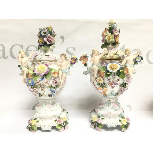 1004 - A pair of Chelsea porcelain Potpourri vases , some damage . 21cm tall approximately. This lot cannot... 