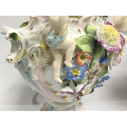 1004 - A pair of Chelsea porcelain Potpourri vases , some damage . 21cm tall approximately. This lot cannot... 