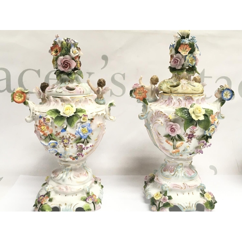 1004 - A pair of Chelsea porcelain Potpourri vases , some damage . 21cm tall approximately. This lot cannot... 